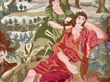 two women that are sitting on a rock in the woods