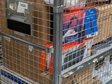 a large metal cart with a lot of boxes on it