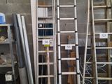 many ladders that are stacked up in a room