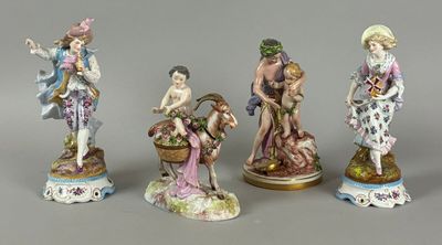 four porcelain figurines of a woman, a man, and a child