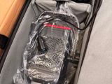 a suitcase with a radio in it sitting on the floor