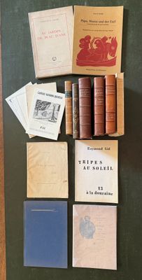 many books on display on a table next to each other