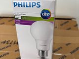 a box of philips led bulbs sitting on top of a cardboard box