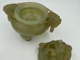 pair of green jade carved vases with handles and handles