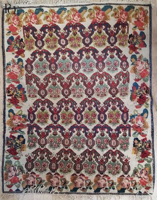 an antique persian rug with a floral design