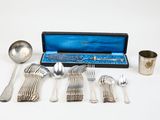 a box with silverware on a white surface