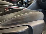 a close up of a car ' s interior with a steering wheel