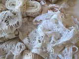 a pile of white lace on a white table