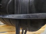 a close up of a black leather bag with a name on it