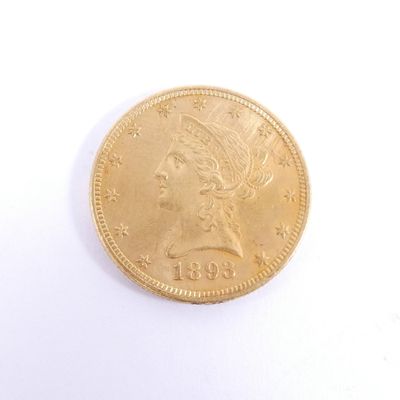 l'image d'une pièce d'or sur laquelle figure une tête de femme