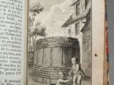 an open book with a drawing of a man sitting on a barrel