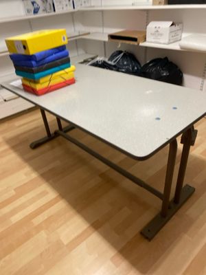 a table that has a bunch of books on it