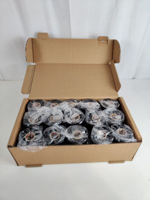 a cardboard box filled with rolls of food on a white surface