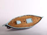 a small boat that is sitting on top of a table