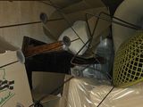 a pile of boxes and other items in a room