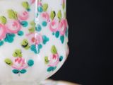 a close up of a cup and saucer on a table