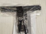 a remote control in a plastic bag on a bed