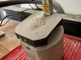 a machine that is sitting on top of a red mat