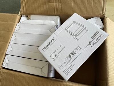 a cardboard box that has a bunch of electronic devices in it