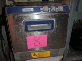 an image of a machine that has a pink sticker on it