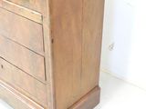 an old wooden cabinet with drawers and a door