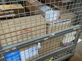 a metal cart with boxes on it in a warehouse