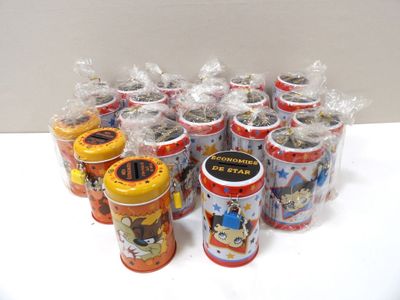 a lot of small tins that are sitting on a table