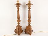 pair of carved wood candlesticks with turned heads