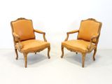 pair of french louis xv style carved wood armchairs