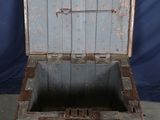an old wooden box with a metal latch on it