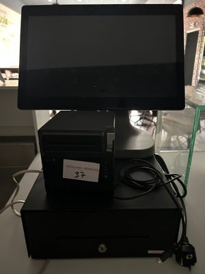 a computer sitting on top of a small black box