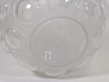 a clear glass bowl on a white surface