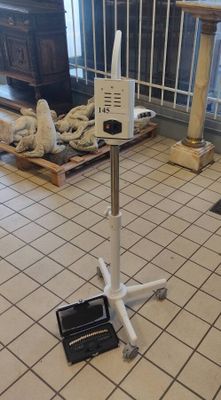 a picture of a floor stand with a laptop on top of it