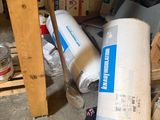 a pile of toilet paper on the floor in a room