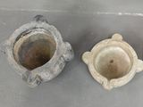 two vases that are sitting next to each other on a table