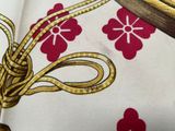 a picture of a close up of a red and white flowered fabric