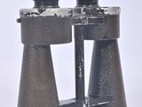 a pair of binoculars that are sitting on a white surface