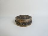 an antique silver and gold box on a white background
