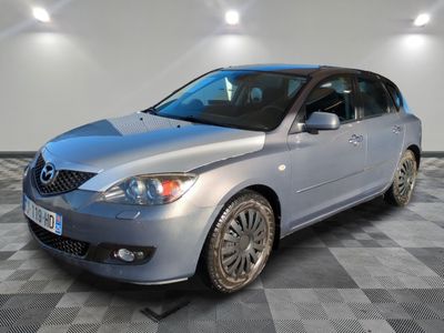 a picture of a silver car parked in a garage