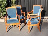 three chairs that are sitting in the parking lot