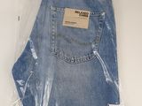 the back of a pair of blue jeans wrapped in plastic