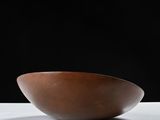 bowl on a white table with a black background