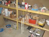 a room that has a bunch of shelves and tools on it