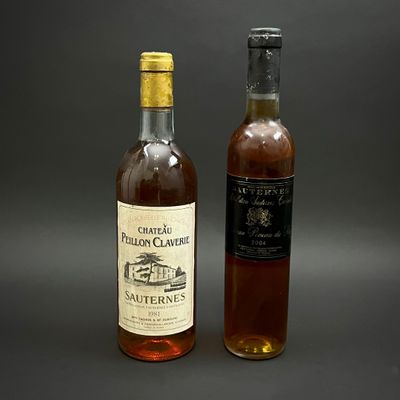 deux bouteilles de vin posées l'une à côté de l'autre sur une table
