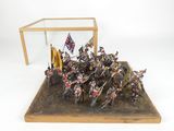 a small display case with a group of soldiers holding flags