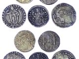 six different types of silver coins are shown on a white surface