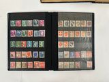 a lot of stamps on the pages of a book