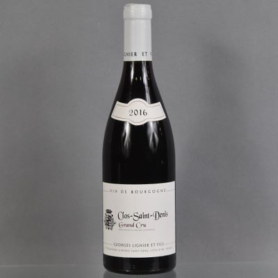 a bottle of wine that is sitting on a table