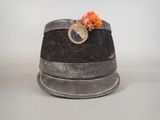 a hat with a fan on top of it on a table
