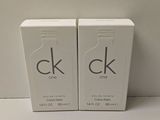 two boxes of calvin calvin one cologne sitting on a table